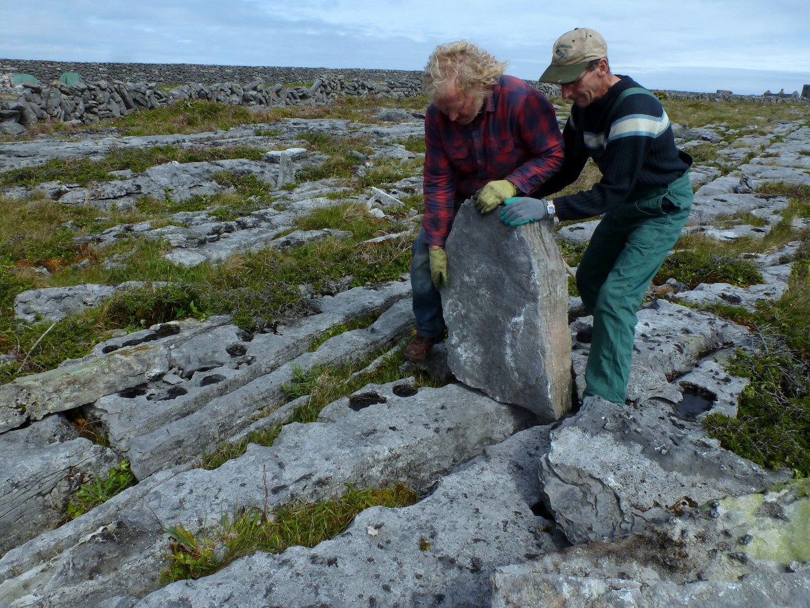 Padraig and Eddie position the first stone